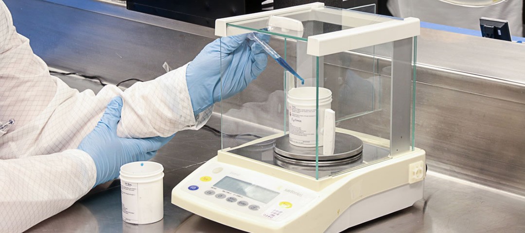 Mixing a two-part adhesive manually.